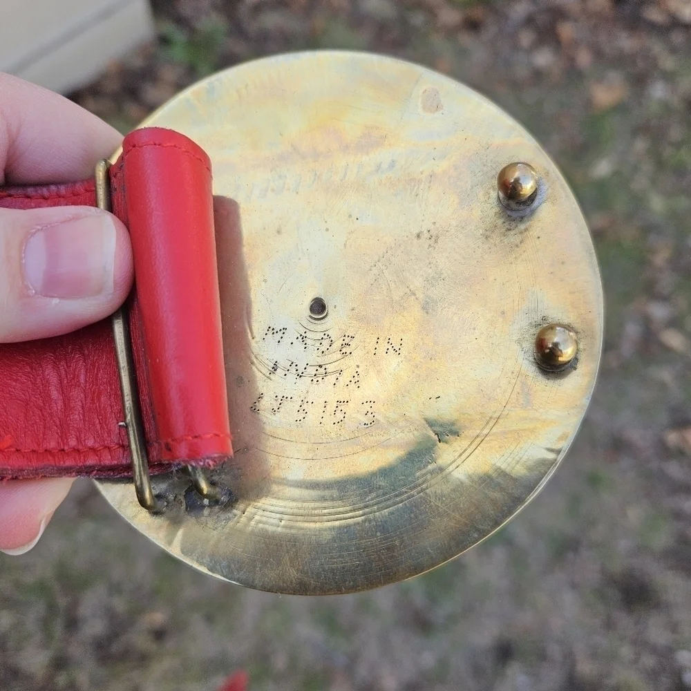 vintage Golden Hands wide red belt with round enamel brass buckle